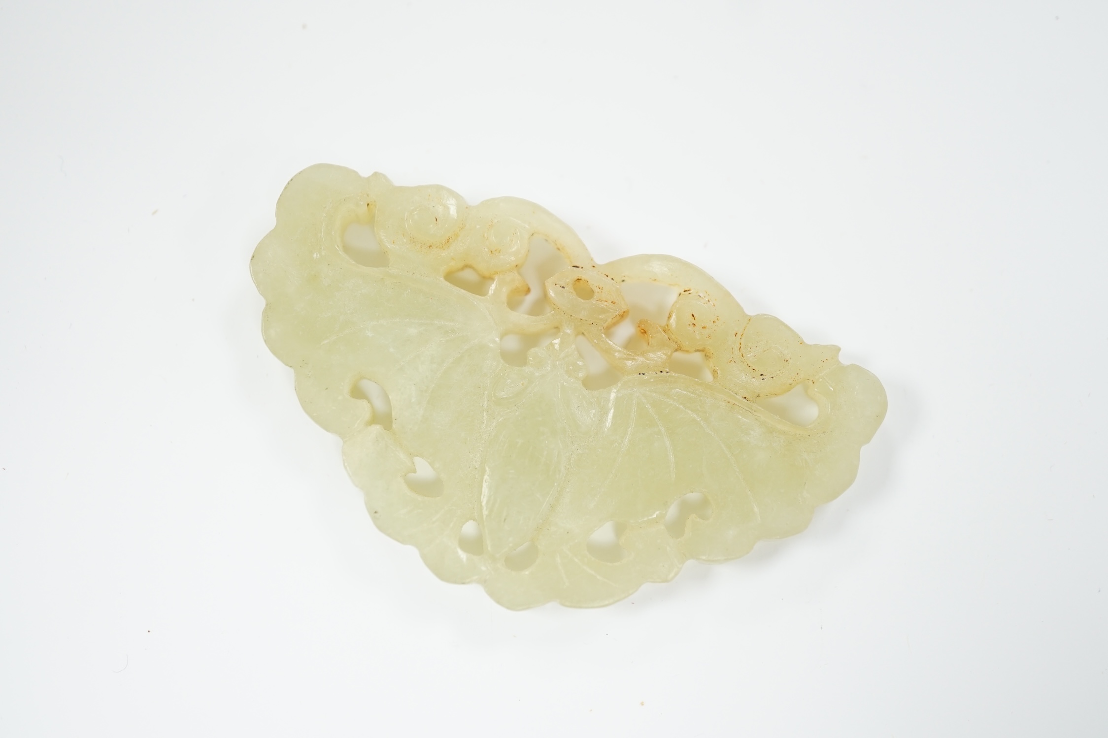 A Chinese carved jade plaque, 5.2cm wide
